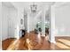 Elegant foyer featuring hardwood floors, decorative columns, and abundant natural light at 929 Blacksnake Rd, Stanley, NC 28164
