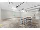 Empty three car garage with a work table at 929 Blacksnake Rd, Stanley, NC 28164