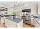 Bright kitchen with stainless steel appliances, granite countertops, and custom cabinetry at 929 Blacksnake Rd, Stanley, NC 28164