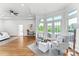 Bright living room boasts hardwood floors, French doors to patio, and comfortable seating arrangement at 929 Blacksnake Rd, Stanley, NC 28164