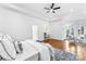 Spacious main bedroom features tray ceiling, hardwood floors, and access to a private sitting area at 929 Blacksnake Rd, Stanley, NC 28164