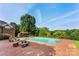Outdoor swimming pool with a brick patio, gazebo, and mature trees at 929 Blacksnake Rd, Stanley, NC 28164