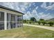 Exterior view of a screened-in porch with backyard, lawn, and driveway at 9507 Pointer Rd, Huntersville, NC 28078