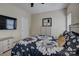 Comfortable bedroom with bright bedding, wood furniture, and carpeted floors at 9507 Pointer Rd, Huntersville, NC 28078