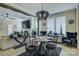 Stylish dining area featuring modern chandelier and sleek black table set at 9507 Pointer Rd, Huntersville, NC 28078