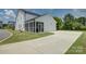 Exterior view of a white house with a screened-in porch, garage, and driveway at 9507 Pointer Rd, Huntersville, NC 28078