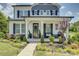 Beautiful two-story home with landscaped front yard and inviting covered porch at 9507 Pointer Rd, Huntersville, NC 28078