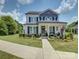 Charming two-story home with landscaped front yard and welcoming front porch at 9507 Pointer Rd, Huntersville, NC 28078
