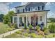 Beautiful two-story home with landscaped front yard and welcoming covered porch at 9507 Pointer Rd, Huntersville, NC 28078