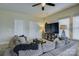 Comfortable living room features a large sectional sofa, television, and neutral paint at 9507 Pointer Rd, Huntersville, NC 28078