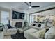 Cozy living room with fireplace, large TV, and open view to the kitchen at 9507 Pointer Rd, Huntersville, NC 28078