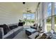 Relaxing screened porch with comfortable seating and outdoor view at 9507 Pointer Rd, Huntersville, NC 28078