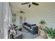 Inviting screened porch with ceiling fans and comfortable outdoor furniture at 9507 Pointer Rd, Huntersville, NC 28078