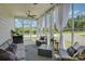 Relaxing screened-in porch with comfortable seating and scenic view at 9507 Pointer Rd, Huntersville, NC 28078