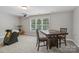 Spacious bonus room includes a pool table, game table, and large window at 9735 Devonshire Dr, Huntersville, NC 28078