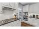 Close up of kitchen featuring stainless steel appliances, white subway tile, and gray countertop at 9735 Devonshire Dr, Huntersville, NC 28078