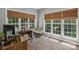 Inviting home office with natural light, tiled floor, and comfortable chair at 9735 Devonshire Dr, Huntersville, NC 28078