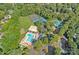 An aerial view shows the community pool, tennis courts, sand volleyball court and playground at 10500 Kilmory Ter, Charlotte, NC 28210