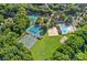 An aerial view of community amenities including the pool, clubhouse, and tennis courts at 10500 Kilmory Ter, Charlotte, NC 28210