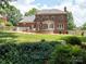 Large brick home with an expansive backyard, ideal for outdoor activities and gatherings at 10500 Kilmory Ter, Charlotte, NC 28210