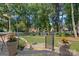 A landscaped backyard featuring a beautiful garden with pavers and decorative plants at 10500 Kilmory Ter, Charlotte, NC 28210