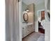 Bright bathroom with a vanity, large mirror, and coordinated fixtures at 10500 Kilmory Ter, Charlotte, NC 28210