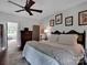 Bedroom featuring hardwood floors, comfortable bedding, and natural light at 10500 Kilmory Ter, Charlotte, NC 28210