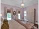 Elegant bedroom featuring a chandelier and plenty of natural light at 10500 Kilmory Ter, Charlotte, NC 28210