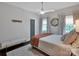 Bright bedroom with a ceiling fan, neutral decor, and hardwood floors at 10500 Kilmory Ter, Charlotte, NC 28210