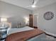 Inviting bedroom featuring a ceiling fan, and hardwood floors at 10500 Kilmory Ter, Charlotte, NC 28210