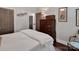 Charming bedroom with dark wood floors and a large, dark wood dresser at 10500 Kilmory Ter, Charlotte, NC 28210