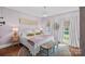 Spacious bedroom with natural light and neutral tones, with a round rug at 10500 Kilmory Ter, Charlotte, NC 28210