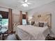 Charming bedroom featuring hardwood floors, decorative headboard and window at 10500 Kilmory Ter, Charlotte, NC 28210