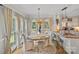 Charming dining area with large windows and a view of the backyard at 10500 Kilmory Ter, Charlotte, NC 28210