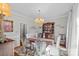 Elegant dining room with a chandelier and traditional wood furniture at 10500 Kilmory Ter, Charlotte, NC 28210