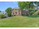 Charming two-story brick home with lush front lawn and mature landscaping at 10500 Kilmory Ter, Charlotte, NC 28210