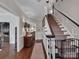 Elegant foyer features hardwood floors, staircase, and stylish decor at 10500 Kilmory Ter, Charlotte, NC 28210