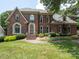 Charming brick home featuring well-manicured landscaping and a welcoming front entrance at 10500 Kilmory Ter, Charlotte, NC 28210