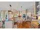 Bright kitchen with custom cabinets, butcher block island, granite countertops, and stainless steel appliances at 10500 Kilmory Ter, Charlotte, NC 28210