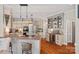 Well-appointed kitchen with granite countertops, island cooktop, wine cooler, and custom cabinetry for elegant storage at 10500 Kilmory Ter, Charlotte, NC 28210