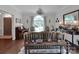 Elegant living room with large window, traditional decor, and hardwood floors at 10500 Kilmory Ter, Charlotte, NC 28210
