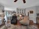 Open living room with seamless flow to the kitchen and dining area, featuring hardwood floors and neutral tones at 10500 Kilmory Ter, Charlotte, NC 28210