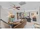 Spacious living room with a ceiling fan, comfortable seating, and natural light at 10500 Kilmory Ter, Charlotte, NC 28210