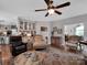 Cozy living room with hardwood floors and elegant furnishings, adjacent to the kitchen and dining spaces at 10500 Kilmory Ter, Charlotte, NC 28210