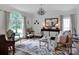 Bright living room with large window, elegant furnishings, and hardwood floors at 10500 Kilmory Ter, Charlotte, NC 28210