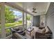 Cozy covered back porch with string lights and wicker furniture overlooking the backyard at 15628 Waterfront Dr, Huntersville, NC 28078