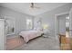 Serene bedroom with neutral walls, soft carpet, and a comfortable bed with patterned accents at 15628 Waterfront Dr, Huntersville, NC 28078