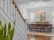 Bright dining room with a large table, decorative light fixture, and plenty of natural light at 15628 Waterfront Dr, Huntersville, NC 28078