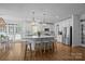 Spacious kitchen with stainless steel appliances, white cabinets, a large island and breakfast nook at 15628 Waterfront Dr, Huntersville, NC 28078
