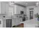 Kitchen features stainless appliances, sleek countertops, white cabinets, and subway tile backsplash at 15628 Waterfront Dr, Huntersville, NC 28078